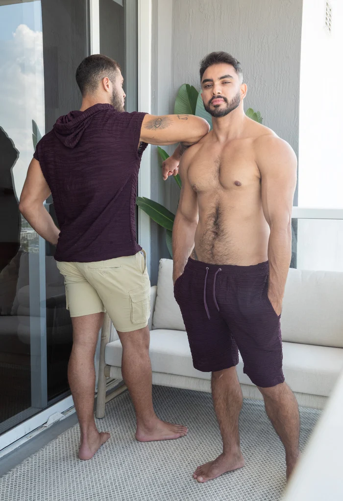 Two ES Collection models wearing burgundy and neutral casual looks in a bright room